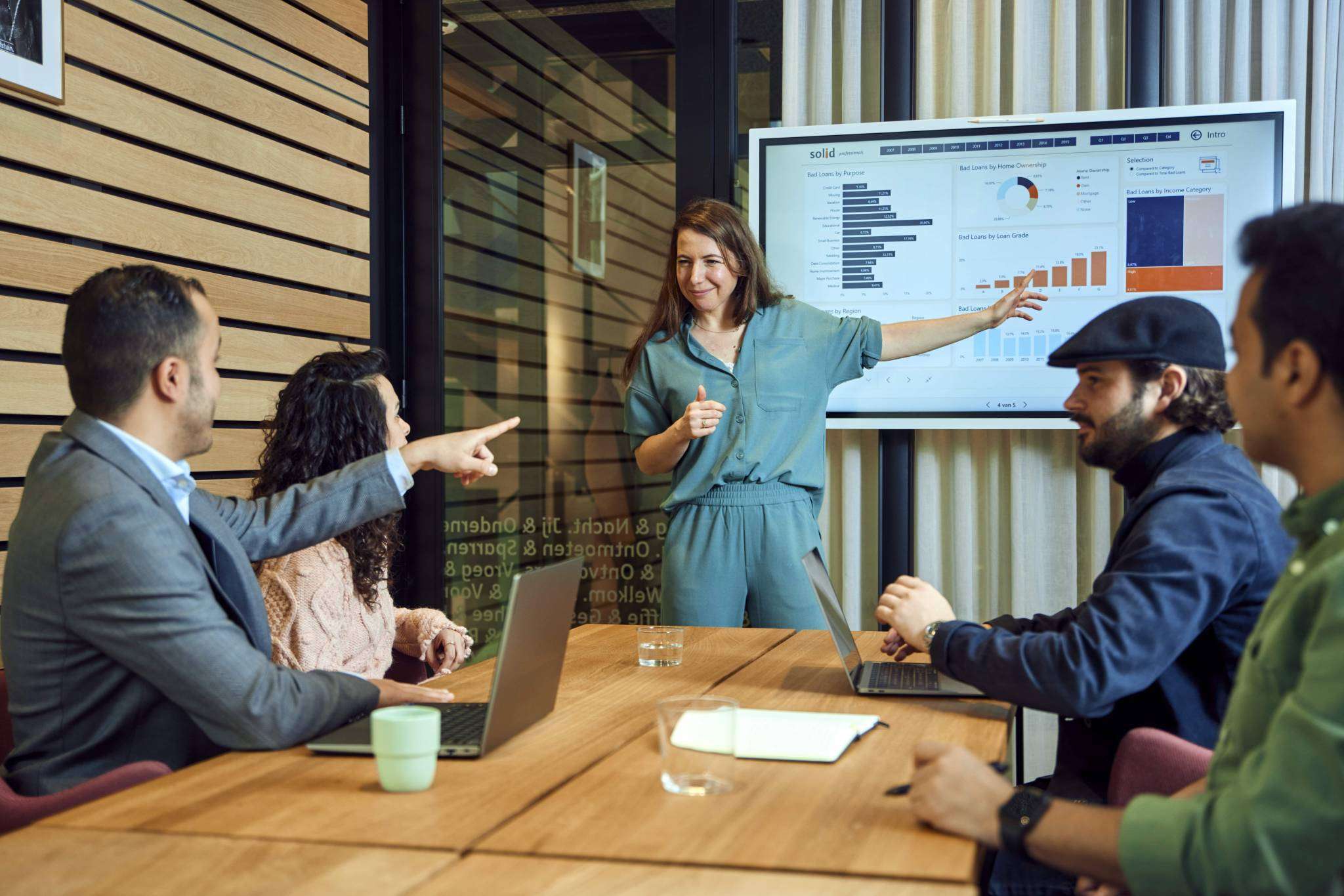 Woman presenting to young professionals.